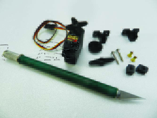 HS-5087MH digital micro servo with mounting hardware and supplied extra servo arms.